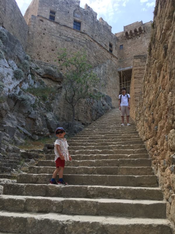 Walking up the stairs of Lindos Acropolis. Discovering Rhodes